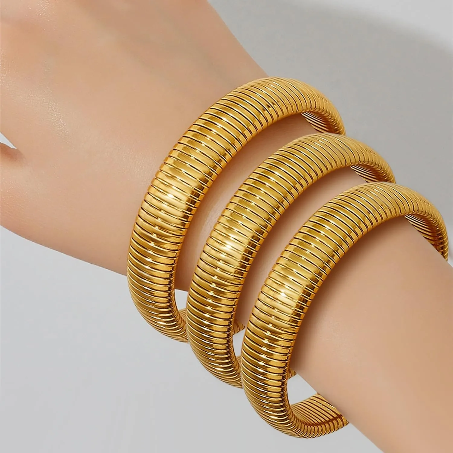 Gold Bangles for Women Set of 3 Chunky Stretch Bangles Bracelets 24K Gold Plated Stainless Steel Bracelets Flexible Wide Stack Bracelets Designer Look Alike Jewelry for Women