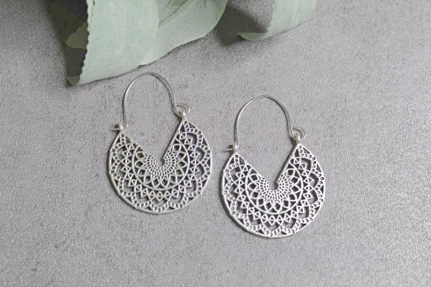 Silvertone earrings with scrolling details
